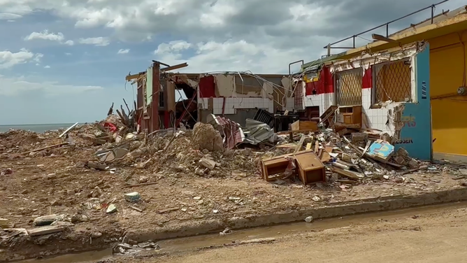 A building black River lies in ruin two weeks after Hurricane Melissa tore through Jamaica.